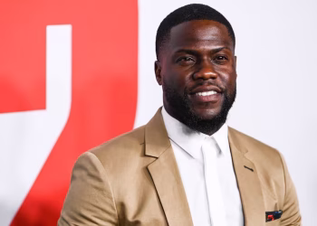 Comedian Kevin Hart arriving at a red carpet event amid ongoing court battle